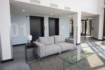 Winnipeg apartment for rent - a living room with a couch and a glass table