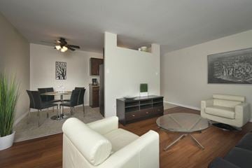 Winnipeg apartment for rent - a living room and dining room with a table and chairs