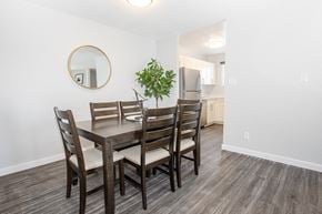 Winnipeg apartment for rent - a dining room with a table and chairs and a kitchen
