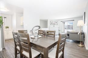Winnipeg apartment for rent - a dining room with a wooden table and chairs