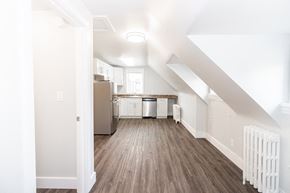 Winnipeg triplex for rent - a kitchen and living room in an attic