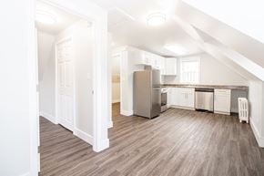 Winnipeg triplex for rent - a kitchen and living room in an attic