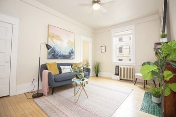 Winnipeg apartment for rent - a living room with a couch and a ceiling fan