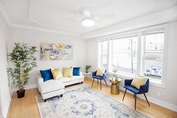 Winnipeg apartment for rent - a living room with a couch and two chairs