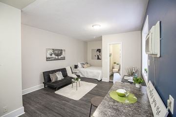 Winnipeg apartment for rent - a living room with a couch and a table