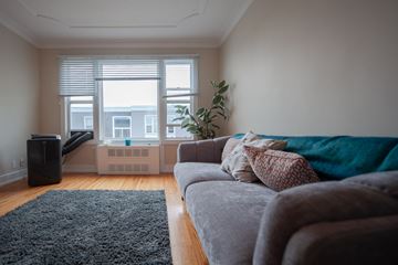 Winnipeg apartment for rent - a living room with a couch and a window