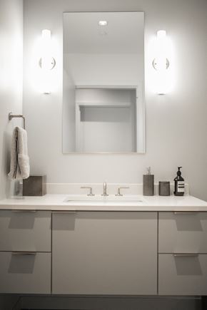 Portland apartment for rent - a white bathroom with a sink and a mirror