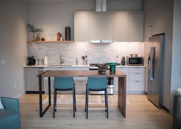Portland apartment for rent - A kitchen with a table and chairs in front of it.