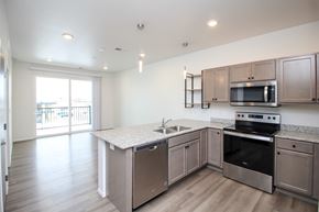 Sioux Falls apartment for rent - A kitchen with a stove, oven, and sink.