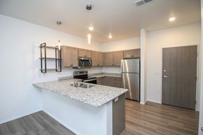 Sioux Falls apartment for rent - A kitchen with a granite countertop and stainless steel appliances.