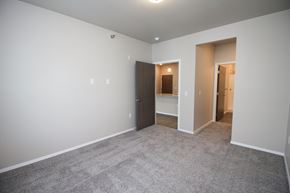 Sioux Falls apartment for rent - A room with a carpeted floor and two open doors.