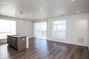Sioux Falls apartment for rent - A spacious room with a desk and a window overlooking the street.