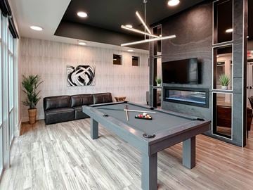 Sioux Falls apartment for rent - A room with a pool table and a fireplace.