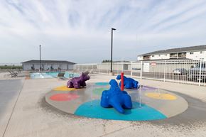 Sioux Falls apartment for rent - A playground with a purple elephant and blue bear on the ground.