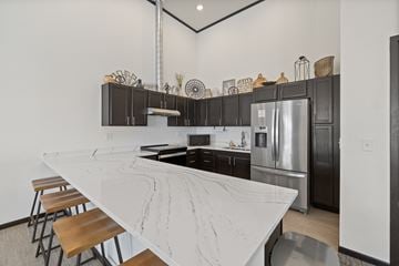 Rapid City apartment for rent - A kitchen with a marble countertop and stainless steel appliances.