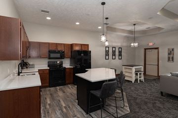 Sioux Falls townhouse for rent - a kitchen and living room with a table and chairs