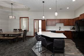 Sioux Falls townhouse for rent - a kitchen and dining room with a table and chairs