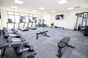 Sioux Falls apartment for rent - A gym with treadmills, weights, and exercise equipment.