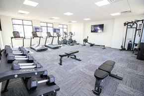 Sioux Falls apartment for rent - A gym with treadmills, weights, and exercise equipment.