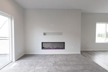 Sioux Falls apartment for rent - a living room with a fireplace and a carpet