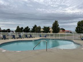 Sioux Falls townhouse for rent - A small pool with a metal fence around it.