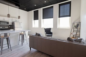 Sioux Falls apartment for rent - a kitchen and living room with a couch and a table