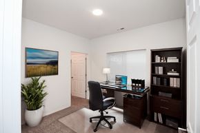 Rapid City apartment for rent - A room with a desk, chair, and bookshelf.