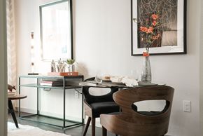 San Antonio apartment for rent - A modern dining room with a glass table and a wooden chair.