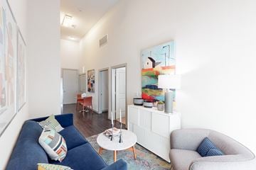 San Antonio apartment for rent - A blue couch with a pillow on it sits in a living room.