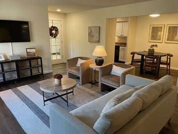 Manchester townhouse for rent - A living room with a grey sofa and a coffee table.