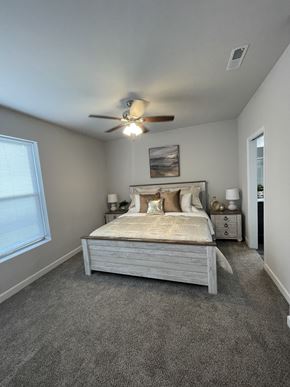 Arnold apartment for rent - a bedroom with a bed and a ceiling fan