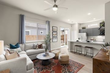 Georgetown apartment for rent - A living room with a grey couch and a coffee table.