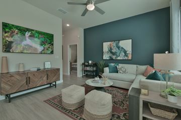 Georgetown apartment for rent - A living room with a rug, a couch, a table, and a painting on the wall.