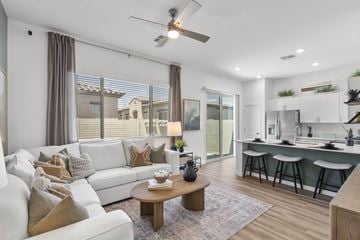 Buckeye apartment for rent - A living room with a white couch and a coffee table.