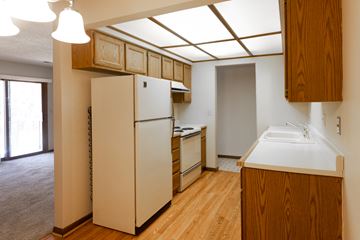 Omaha apartment for rent - a kitchen with a refrigerator and a sink in a house
