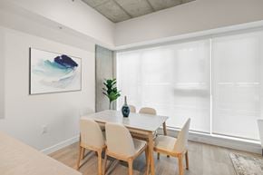 Victoria apartment for rent - A dining room with a table and chairs.