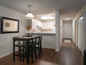 Pensacola apartment for rent - a kitchen and a dining room with a table and chairs at The Fountains Apartments, Pensacola, 32514