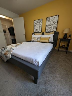 Oviedo apartment for rent - a bedroom with a bed and two paintings on the wall at Tivoli Apartments of Orlando, Oviedo, FL