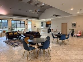 Gainesville apartment for rent - A modern dining room with a round table and chairs.