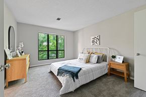 Acworth apartment for rent - a bedroom with a bed and a dresser at Waldan Pond Apartments, Georgia, 30102