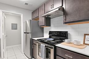 Acworth apartment for rent - a kitchen with stainless steel appliances and a refrigerator