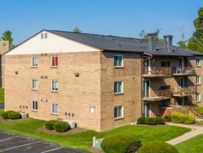 Batavia apartment for rent - a brick apartment building with balconies and grass