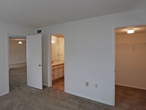 Batavia apartment for rent - an empty living room with an open door to a bathroom