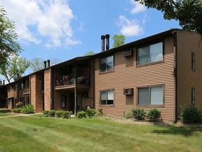 Cincinnati apartment for rent - a large apartment building with a yard in front of it