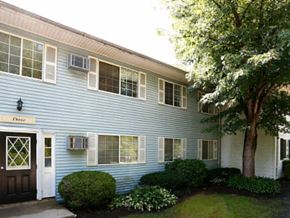 Cincinnati apartment for rent - a blue house with a tree in front of it