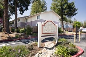 Campbell apartment for rent - A sign for 825 San Tomas Gardens is in front of a building.