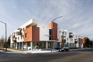 San Jose apartment for rent - A modern building with a mix of white and orange panels.