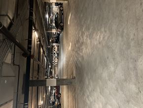 San Jose apartment for rent - A long hallway with cars on the ceiling.