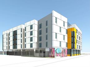 San Jose apartment for rent - A modern building with a white facade and a yellow section on the right side.