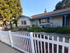 San Jose apartment for rent - A white picket fence in front of a house.